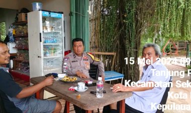 Bhabinkamtibmas Tanjung Pinggir Sambangi Warga Bahas Jaga Kamtibmas